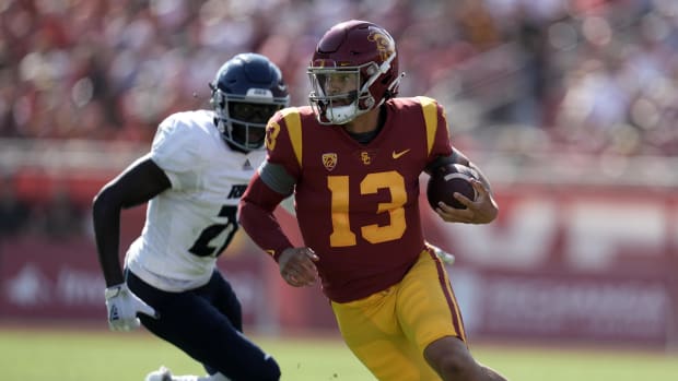 Sep 3, 2022; Los Angeles, California, USA; Southern California Trojans quarterback Caleb Williams (13) carries the ball in the first half against the Rice Owls at United Airlines Field at Los Angeles Memorial Coliseum. Mandatory Credit: Kirby Lee-USA TODAY Sports