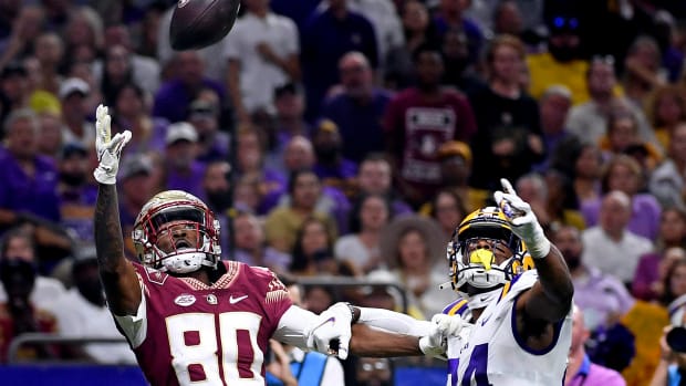 Sep 4, 2022; New Orleans, Louisiana, USA; Florida State Seminoles wide receiver Ontaria Wilson (80) makes a catch past Louisiana State Tigers cornerback Jarrick Bernard-Converse during the second half at Caesars Superdome. Mandatory Credit: Melina Myers-USA TODAY Sports
