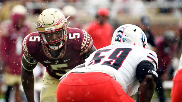 Aug 27, 2022; Tallahassee, Florida, USA; Florida State Seminoles defensive end Jared Verse (5) lines up against Duquesne Dukes offensive lineman Chris Oliver (59) during the first half at Doak S. Campbell Stadium. Mandatory Credit: Melina Myers-USA TODAY Sports