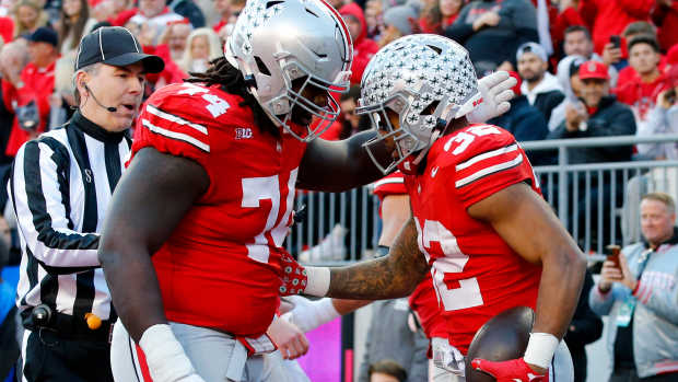 Nov 18, 2023; Columbus, Ohio, USA; Ohio State Buckeyes running back TreVeyon Henderson (32) celebrates his touchdown run with offensive lineman Donovan Jackson (74) during the first quarter against the Minnesota Golden Gophers at Ohio Stadium. Mandatory Credit: Joseph Maiorana-USA TODAY Sports