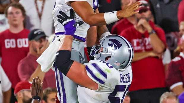 Sep 24, 2022; Norman, Oklahoma, USA; Kansas State Wildcats quarterback Adrian Martinez (9) celebrates with offensive lineman Cooper Beebe (50) after scoring a touchdown during the second half against the Oklahoma Sooners at Gaylord Family-Oklahoma Memorial Stadium.