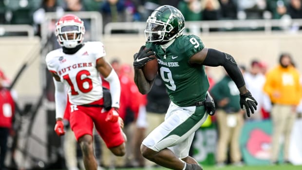 Michigan State's Daniel Barker runs for a touchdown after a catch against Rutgers during the first quarter on Saturday, Nov. 12, 2022, in East Lansing.