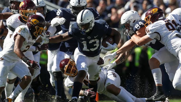 Sep 24, 2022; University Park, Pennsylvania, USA; Penn State Nittany Lions running back Kaytron Allen (13) runs through the Central Michigan Chippewas defense during the fourth quarter at Beaver Stadium. Penn State defeated Central Michigan 33-14.