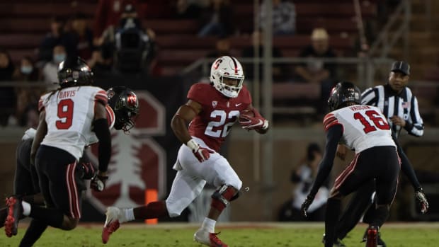 Nov 5, 2021; Stanford, California, USA; Stanford Cardinal running back E.J. Smith (22) runs with the football during the first quarter against the Utah Utes at Stanford Stadium.