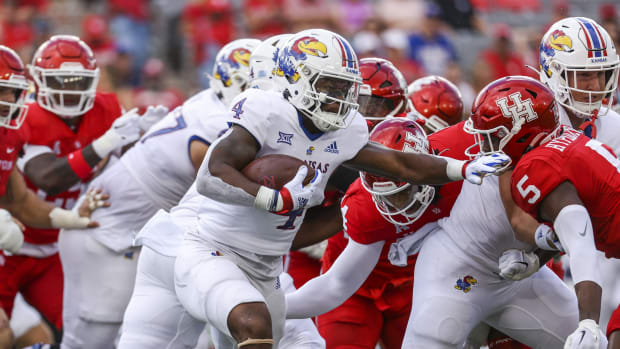 Sep 17, 2022; Houston, Texas, USA; Kansas Jayhawks running back Devin Neal (4) runs with the ball during the first quarter against the Houston Cougars at TDECU Stadium.