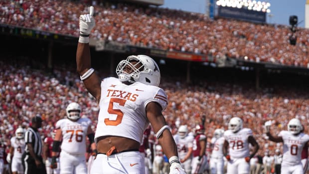 Oct 8, 2022; Dallas, Texas, USA: Texas Longhorns running back Bijan Robinson (5) celebrates after scoring a touchdown in the Oklahoma Sooners during the annual Red River Showdown against at the Cotton Bowl.