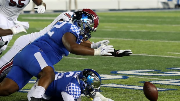 Kentucky s Justin Rogers goes for the fumble against South Carolina.Oct. 8, 2022