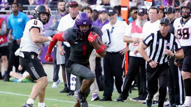 Oct 15, 2022; Fort Worth, Texas, USA; TCU Horned Frogs wide receiver Quentin Johnston (1) runs after the catch against the Oklahoma State Cowboys during the second half at Amon G. Carter Stadium.