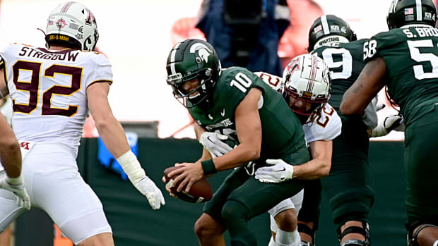 Sep 24, 2022; East Lansing, Michigan, USA; Michigan State Spartans quarterback Payton Thorne (10) gets sacked by Minnesota Golden Gophers defensive back Ryan Stapp (22) in the first quarter at Spartan Stadium.