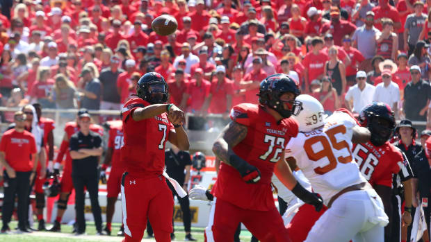 Sep 24, 2022; Lubbock, Texas, USA; Texas Tech Red Raiders quarterback Donovan Smith (7) passes against the Texas Longhorns in the first half at Jones AT&T Stadium and Cody Campbell Field.