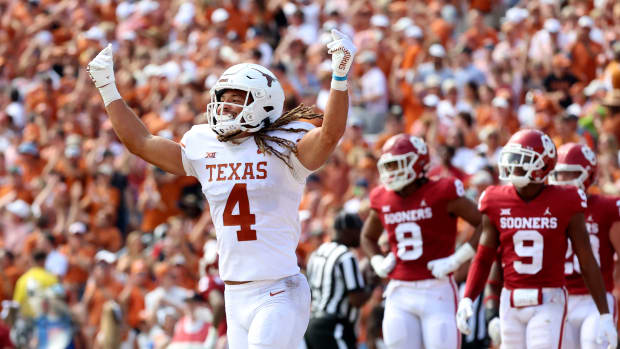 Oct 8, 2022; Dallas, Texas, USA; Texas Longhorns wide receiver Jordan Whittington (4) celebrates after a touchdown during the first half against the Oklahoma Sooners at the Cotton Bowl.