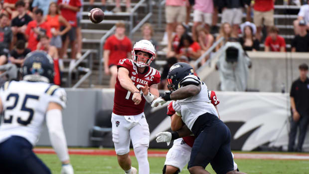 Sep 10, 2022; Raleigh, North Carolina, USA; North Carolina State Wolfpack quarterback Devin Leary (13) throws a pass during the first half against the Charleston Southern Buccaneers at Carter-Finley Stadium.
