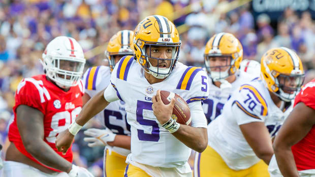 Quarterback Jayden Daniels scores a touchdown as the LSU Tigers take on the Ole Miss Rebels at Tiger Stadium in Baton Rouge, Louisiana,