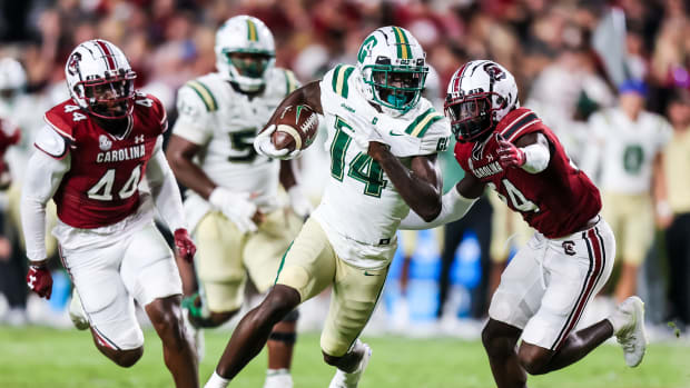 Sep 24, 2022; Columbia, South Carolina, USA; Charlotte 49ers wide receiver Grant DuBose (14) rushes past South Carolina Gamecocks defensive back Marcellas Dial (24) in the second quarter at Williams-Brice Stadium.