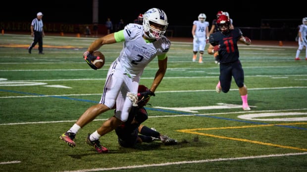 Oct 14, 2022; Scottsdale, AZ, USA; Pinnacle Pioneers senior tight end Duce Robinson (2) is brought down by Chaparral Firebirds middle linebacker Jaden Berman (31) at Chaparral High School s football field.