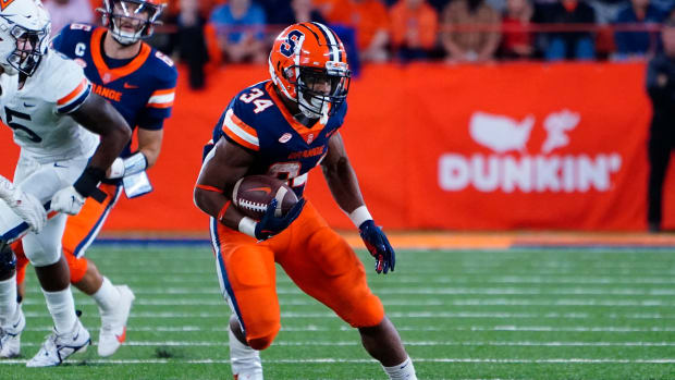 Sep 23, 2022; Syracuse, New York, USA; Syracuse Orange running back Sean Tucker (34) runs with the ball against the Virginia Cavaliersduring the second half at JMA Wireless Dome.