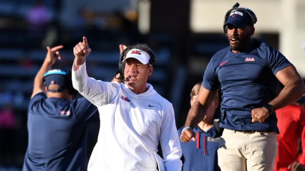 Oct 8, 2022; Nashville, Tennessee, USA; Mississippi Rebels head coach Lane Kiffin and other coaches celebrate after a recovered fumble against the Vanderbilt Commodores during the second half at FirstBank Stadium.