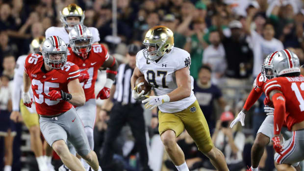 Sep 3, 2022; Columbus, Ohio, USA; Notre Dame Fighting Irish tight end Michael Mayer (87) runs after the catch as Ohio State Buckeyes linebacker Tommy Eichenberg (35) defends during the third quarter at Ohio Stadium.