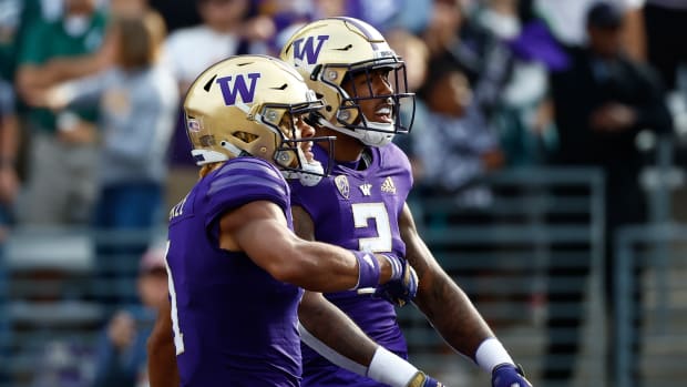 Sep 17, 2022; Seattle, Washington, USA; Washington Huskies wide receiver Ja'Lynn Polk (2) celebrates with wide receiver Rome Odunze (1) after catching a touchdown pass against the Michigan State Spartans during the first quarter at Alaska Airlines Field at Husky Stadium.