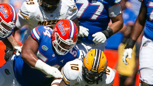 Missouri Tigers wide receiver Mekhi Miller (10) and Florida Gators offensive lineman O'Cyrus Torrence (54) for after fumble as Florida takes on Missouri during homecoming at Steve Spurrier Field at Ben Hill Griffin Stadium in Gainesville, FL on Saturday, October 8, 2022.