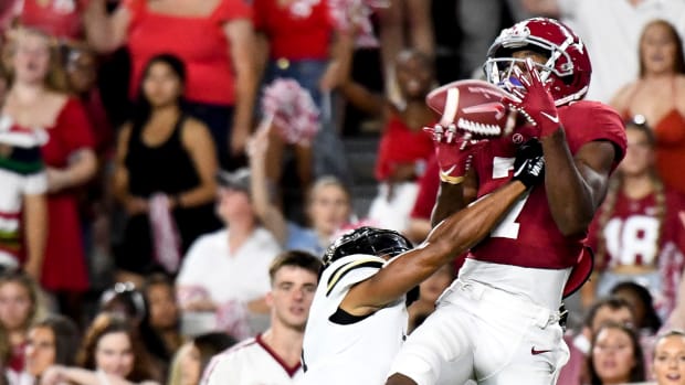 Sep 24, 2022; Tuscaloosa, Alabama, USA; Alabama Crimson Tide wide receiver Ja'Corey Brooks (7) catches a pass for a touchdown against Vanderbilt Commodores defensive back Tyson Russell (8) at Bryant-Denny Stadium.