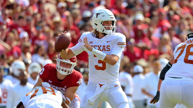 Oct 8, 2022; Dallas, Texas, USA; Texas Longhorns quarterback Quinn Ewers (3) throws during the first half against the Oklahoma Sooners at the Cotton Bowl.