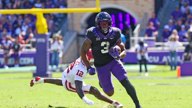 Oct 1, 2022; Fort Worth, Texas, USA; TCU Horned Frogs running back Emari Demercado (3) runs with the ball past Oklahoma Sooners defensive back Key Lawrence (12) during the first half at Amon G. Carter Stadium.