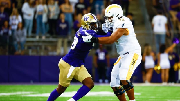 Sep 3, 2022; Seattle, Washington, USA; Washington Huskies defensive lineman Zion Tupuola-Fetui (58) rushes the passer against Kent State Golden Flashes offensive lineman Marcellus Marshall (72) during the third quarter at Alaska Airlines Field at Husky Stadium.