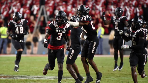 Sep 17, 2022; Raleigh, North Carolina, USA; North Carolina State Wolfpack defensive back Aydan White (3) and teammates celebrate his game-clinching interception during the second half against the Texas Tech Red Raiders at Carter-Finley Stadium.