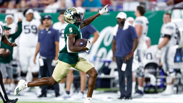 Sep 3, 2022; Tampa, Florida, USA; South Florida Bulls wide receiver Jimmy Horn Jr. (5) runs back a kick off for a touchdown against the Brigham Young Cougars during the second half at Raymond James Stadium.