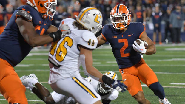 Sep 22, 2022; Champaign, Illinois, USA; Illinois Fighting Illini running back Chase Brown (2) runs the ball for a touchdown during the first half against the Chattanooga Mocs at Memorial Stadium.