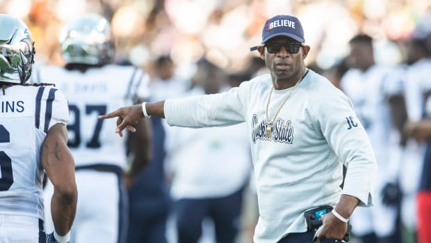 Jackson State Tigers head coach Deion Sanders talks with his players from the sideline as Alabama State Hornets takes on Jackson State Tigers at ASU Stadium in Montgomery, Ala., on Saturday, Oct. 8, 2022.