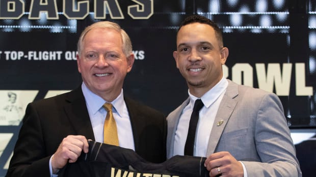 Purdue Director of Athletics Mike Bobinski and Purdue football head coach Ryan Walters pose for a photo during a press conference introducing Walters as the new head coach, Wednesday, Dec. 14, 2022, at the Kozuch Football Performance Complex in West Lafayette, Ind.