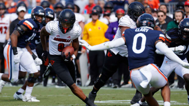 Oct 8, 2022; Charlottesville, Virginia, USA; Louisville Cardinals wide receiver Tyler Hudson (0) runs with the ball as Virginia Cavaliers safety Antonio Clary (0) chases during the second quarter at Scott Stadium