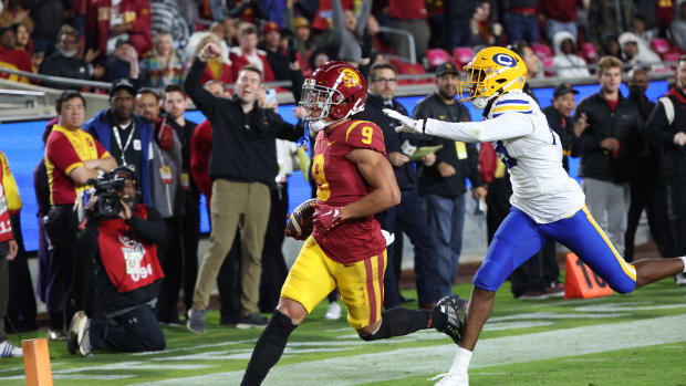 Nov 5, 2022; Los Angeles, California, USA; USC Trojans wide receiver Michael Jackson III (9) scores a touchdown during the third quarter against the California Golden Bears at United Airlines Field at Los Angeles Memorial Coliseum.