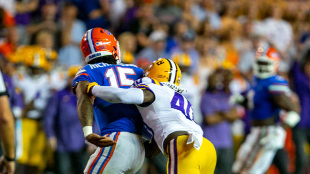 LSU Tigers linebacker Harold Perkins Jr. (40) clobbers Florida Gators quarterback Anthony Richardson (15) shaking loose the ball as Florida takes on LSU at Steve Spurrier Field at Ben Hill Griffin Stadium in Gainesville, FL on Saturday, October 15, 2022. The play was ruled an incomplete pass.