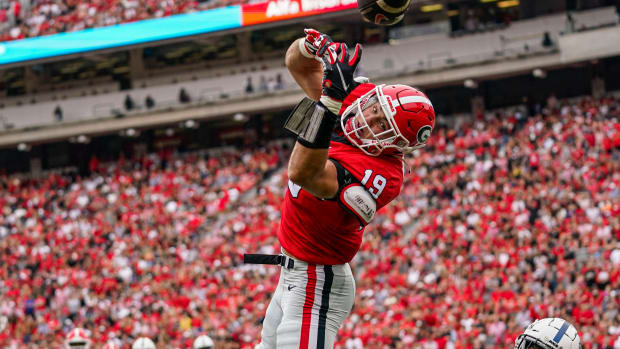 Sep 10, 2022; Athens, Georgia, USA; Georgia Bulldogs tight end Brock Bowers (19) can t hold a pass over Samford Bulldogs safety Wade White (40) in the end zone during the first half at Sanford Stadium.