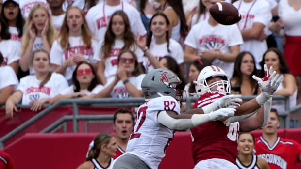 Wisconsin tight end Clay Cundiff (85) reels in a 17-yard touchdown pass while being covered by Washington State linebacker Travion Brown (82) during the second quarter of their game Saturday, September 10, 2022 at Camp Randall Stadium in Madison, Wis.