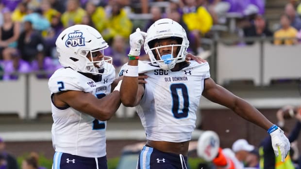 Sep 10, 2022; Greenville, North Carolina, USA; Old Dominion Monarchs wide receiver Ali Jennings III (0) is congratulated by running back Blake Watson (2) after his touchdown catch East Carolina Pirates during the first half at Dowdy-Ficklen Stadium.