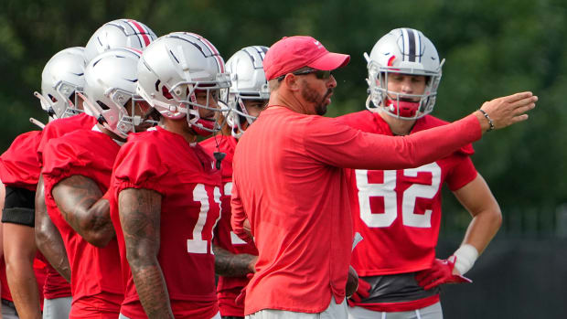 Aug 4, 2022; Columbus, OH, USA; Ohio State Buckeyes passing game coordinator Brian Hartline talks to his wide receivers during the first fall football practice at the Woody Hayes Athletic Center.