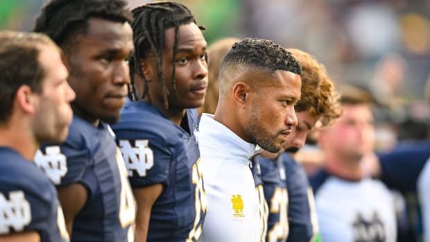 Sep 10, 2022; South Bend, Indiana, USA; Notre Dame Fighting Irish head coach Marcus Freeman stands with his players for the Notre Dame Alma Mater after the game against the Marshall Thundering Herd at Notre Dame Stadium.