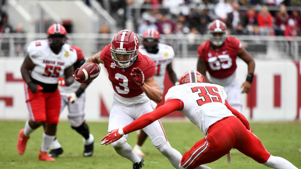 Nov 19, 2022; Tuscaloosa, Alabama, USA; Alabama wide receiver Jermaine Burton (3) tries to evade a tackle by Austin Peay defensive back Ethan Caselberry (35) at Bryant-Denny Stadium.