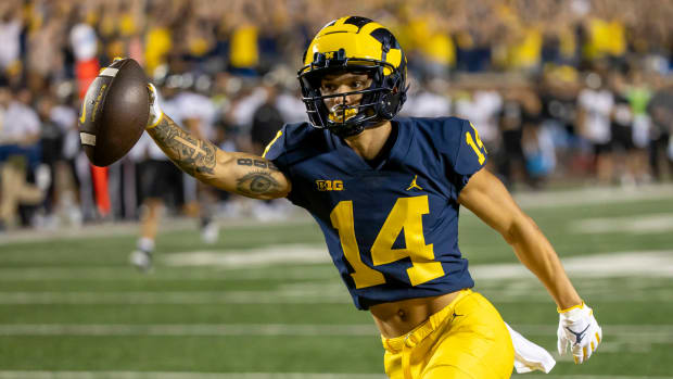 Sep 10, 2022; Ann Arbor, Michigan, USA; Michigan Wolverines wide receiver Roman Wilson (14) catches a pass in the first quarter against the Hawaii Warriors for a touchdown at Michigan Stadium.