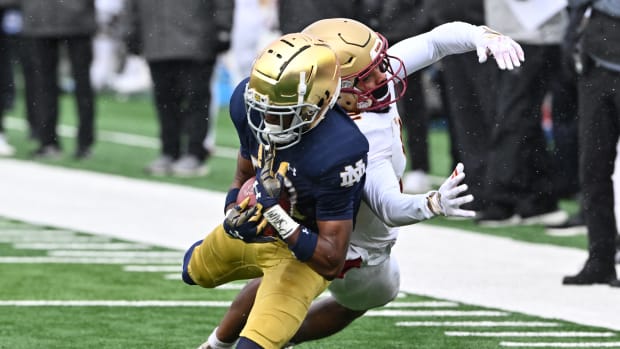 Nov 19, 2022; South Bend, Indiana, USA; Notre Dame Fighting Irish cornerback Benjamin Morrison (20) intercepts a pass intended for Boston College Eagles wide receiver Joseph Griffin (2) in the first quarter at Notre Dame Stadium.