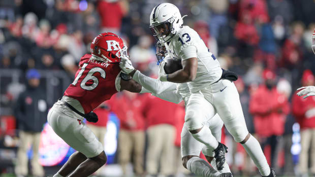Nov 19, 2022; Piscataway, New Jersey, USA; Penn State Nittany Lions running back Kaytron Allen (13) carries the ball in front of Rutgers Scarlet Knights defensive back Max Melton (16) during the second half at SHI Stadium.