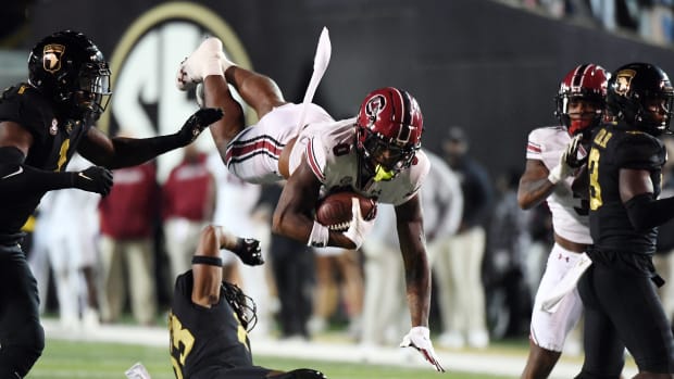 Nov 5, 2022; Nashville, Tennessee, USA; South Carolina Gamecocks tight end Jaheim Bell (0) is hit as he tries to hurdle Vanderbilt Commodores defensive back Jaylen Mahoney (23) during the second half at FirstBank Stadium.