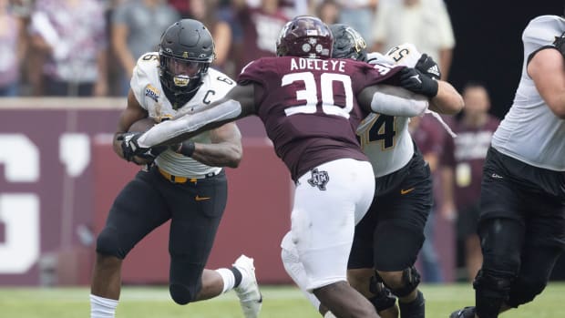 Sep 10, 2022; College Station, Texas, USA; Appalachian State Mountaineers running back Camerun Peoples (6) rushes against Texas A&M Aggies defensive lineman Tunmise Adeleye (30) in the second quarter at Kyle Field.