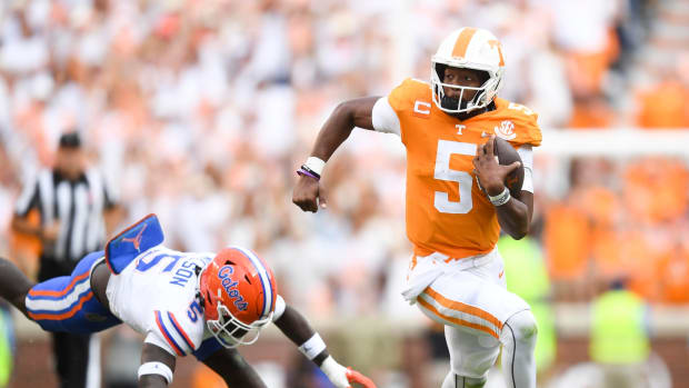 Tennessee quarterback Hendon Hooker (5) runs past Florida safety Kamari Wilson (5) during an NCAA college football game on Saturday, September 24, 2022 in Knoxville, Tenn.