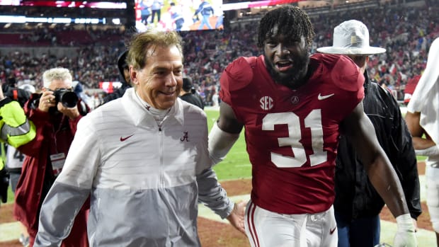 Nov 26, 2022; Tuscaloosa, Alabama, USA; Alabama Crimson Tide head coach Nick Saban and linebacker Will Anderson Jr. (31) share a smile as they leave the field after defeating the Auburn Tigers at Bryant-Denny Stadium. Alabama won 49-27.