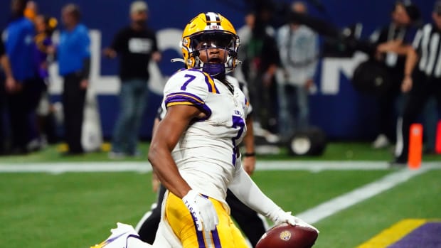 Dec 3, 2022; Atlanta, GA, USA; LSU Tigers wide receiver Kayshon Boutte (7) carries the ball for a receiving touchdown against the Georgia Bulldogs during the first quarter of the SEC Championship game at Mercedes-Benz Stadium.